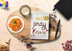 libro eat pray love sobre fondo de viaje