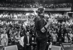 tony robbins speaking animatedly on stage