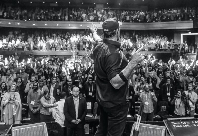 tony robbins speaking animatedly on stage